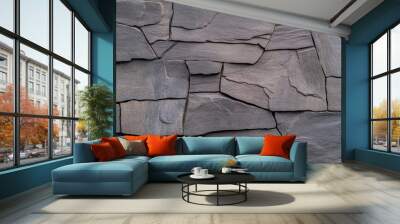 Close-up of a textured grey stone wall. Wall mural