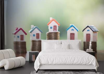 Mini house on stack of coins,Money and house, Real estate investment, Save money with stack coin, Mortgage concept. Wall mural