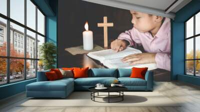 Religious Christian Child  praying over Bible indoors, Religious concepts. Religious beliefs Christian life crisis prayer to god. Wall mural