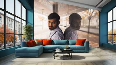 Handsome Indian man posing in an urban context Wall mural