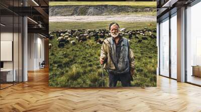 Portrait of shepherd with sheep on a field in the mountains. The concept of modern agriculture and organic products Wall mural