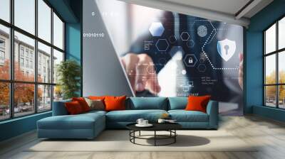 Cyber security, data protection concept. User using laptop computer and mobile phone with privacy security and data encryption system, secure internet access. Cybersecurity software technology Wall mural