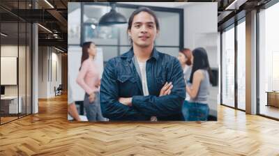 Portrait of successful handsome executive businessman smart casual wear looking at camera and smiling, arms crossed in modern office workplace. Young Asia guy standing in contemporary meeting room. Wall mural