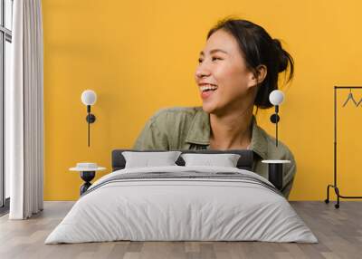 portrait of young asia lady with positive expression, smile broadly, dressed in casual clothing over Wall mural