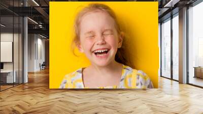 Cheerful girl laughs Wall mural