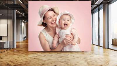 Portrait of handsome mother and cute newborn laughing happy baby  Wall mural