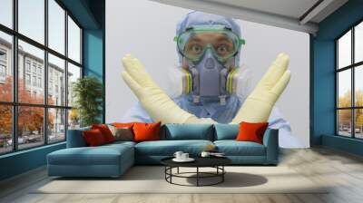 Man in chemical protective suit making stop gesture on white background.Focus on hands. Wall mural