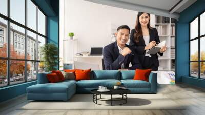 Business women and man working in the office Wall mural