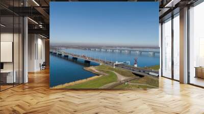 Aerial view of bridge MOERDIJK BRUGGEN over the river HOLLANDSCH DIEP in Holland. Those bridges connect the provinces of Zuid-Holland and Noord-Brabant Wall mural