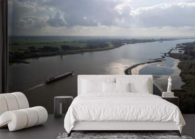 Inland container vessel on River Lek aerial view, the Netherlands Wall mural