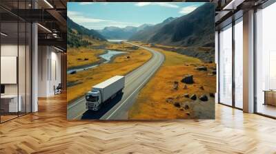 white truck driving on asphalt road on the highway. seen from the air. Aerial view landscape. drone photography. cargo delivery Wall mural