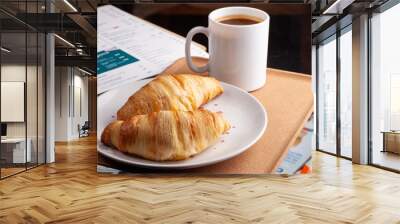 Two delicious croissants with a cup of coffee on the coffee table Wall mural