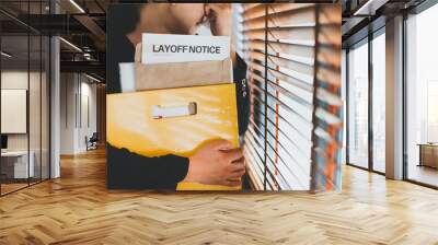 Female employee have stress and sadness after receiving a layoff notice. The impact of the economic recession during the Covid-19(corona virus) outbreak. Wall mural