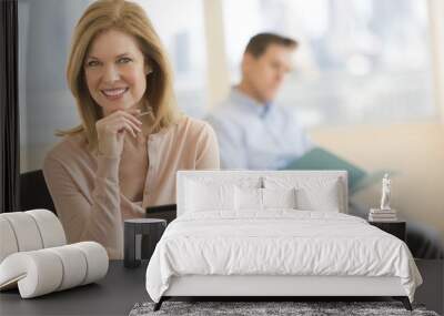 Confident Businesswoman Smiling In Office Wall mural