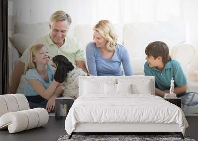 Girl Playing With Dog While Family Looking At Her Wall mural