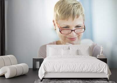 Woman Reading Label On Pill Bottle Wall mural