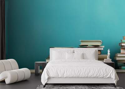 a stack of books on a table next to a blue wall, in the style of retro vintage Wall mural