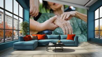 Elderly asian woman on wheelchair at home with daughter take care Wall mural