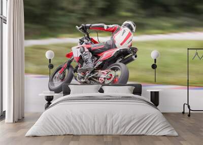 Motorcycle practice leaning into a fast corner on track Wall mural