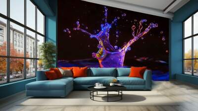 Neon-toned water drops on an isolated black background, creating a dynamic water drops wallpaper Wall mural