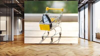 Yellow cart on wood texture. Wall mural