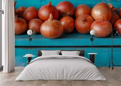 Onions on blue boards: healthy nutrition. Wall mural