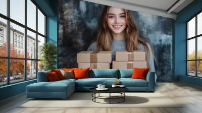 Pretty girl holds boxes Wall mural