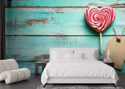 Sweet treat and vacant label illuminated on a teal wooden surface. For your words. Wall mural