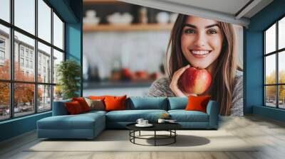 Woman with apple in kitchen Wall mural