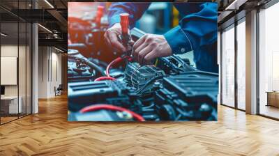 Technician Hands of car mechanic working repair in auto repair Service electric battery and Maintenance of car battery Check the electrical system inside the car  Wall mural