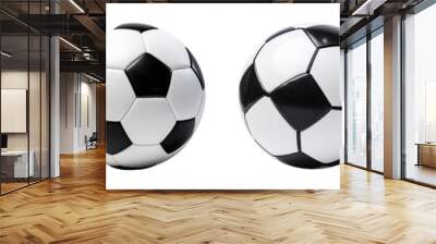 A collection of classic soccer balls, showcasing their iconic black and white design, perfect for sports and recreation themes. Wall mural