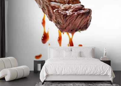 Grilled steak dripping with sauce, isolated on a white background. Perfect for barbecue, meat, or culinary projects. Wall mural