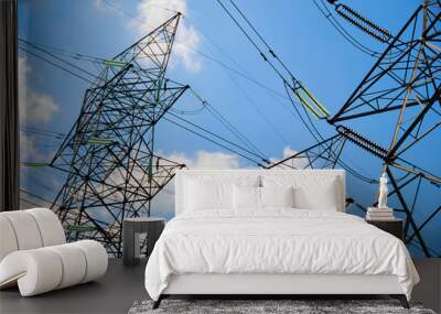 a group of high voltage tower in the blue sky Wall mural