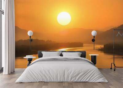 A serene sunrise scene featuring a large sun illuminating a winding river, with a small boat gently floating, surrounded by a landscape of foggy mountains creating a peaceful atmosphere Wall mural