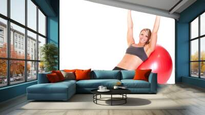 A fit woman doing a push up routine on a red exercise ball Wall mural