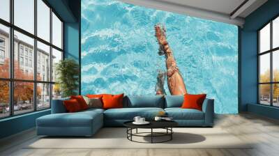 beautiful woman legs splashing in the pool Wall mural