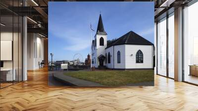 View of the Norwegian Church Arts Centre and against a blue sky on a sunny day, Cardiff Bay, Wales Wall mural