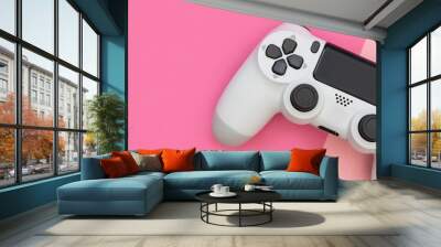 Video game gaming controller on pink color background top view Wall mural