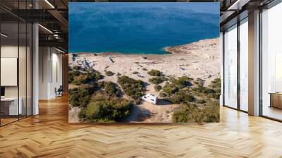 White camper, rv, motorhome standing at a beach camp spot, Vis Island, Croatia Wall mural