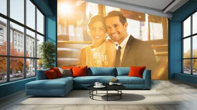 Couple toasting champagne flutes in restaurant Wall mural