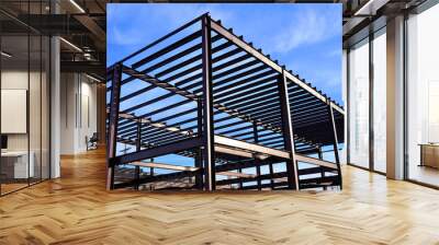 Steel framework of commercial building under  construction. Wall mural