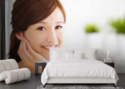 beautiful and smiling asian young woman Wall mural