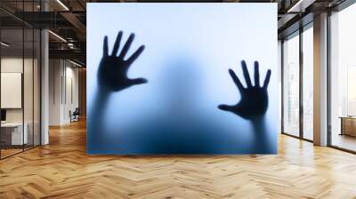 blur hand of man touching glass Wall mural