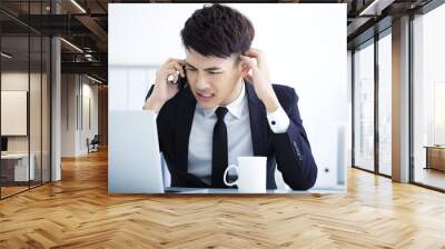 Businessman having stress in the office Wall mural