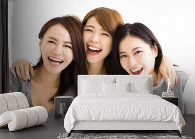 Closeup happy Young Women Faces Looking at Camera Wall mural