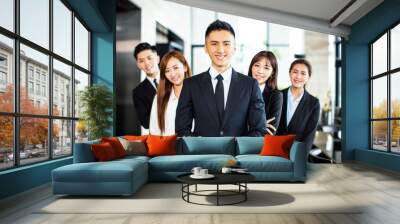 confident asian business team stands in office Wall mural