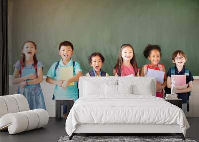 Group of diverse young students standing together in classroom Wall mural