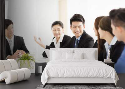 Group of happy young business people in  meeting Wall mural