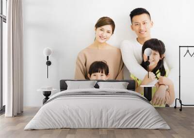 Happy Attractive Young  Family Portrait Wall mural