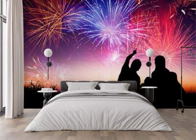 happy family sitting on floor and watching the fireworks Wall mural